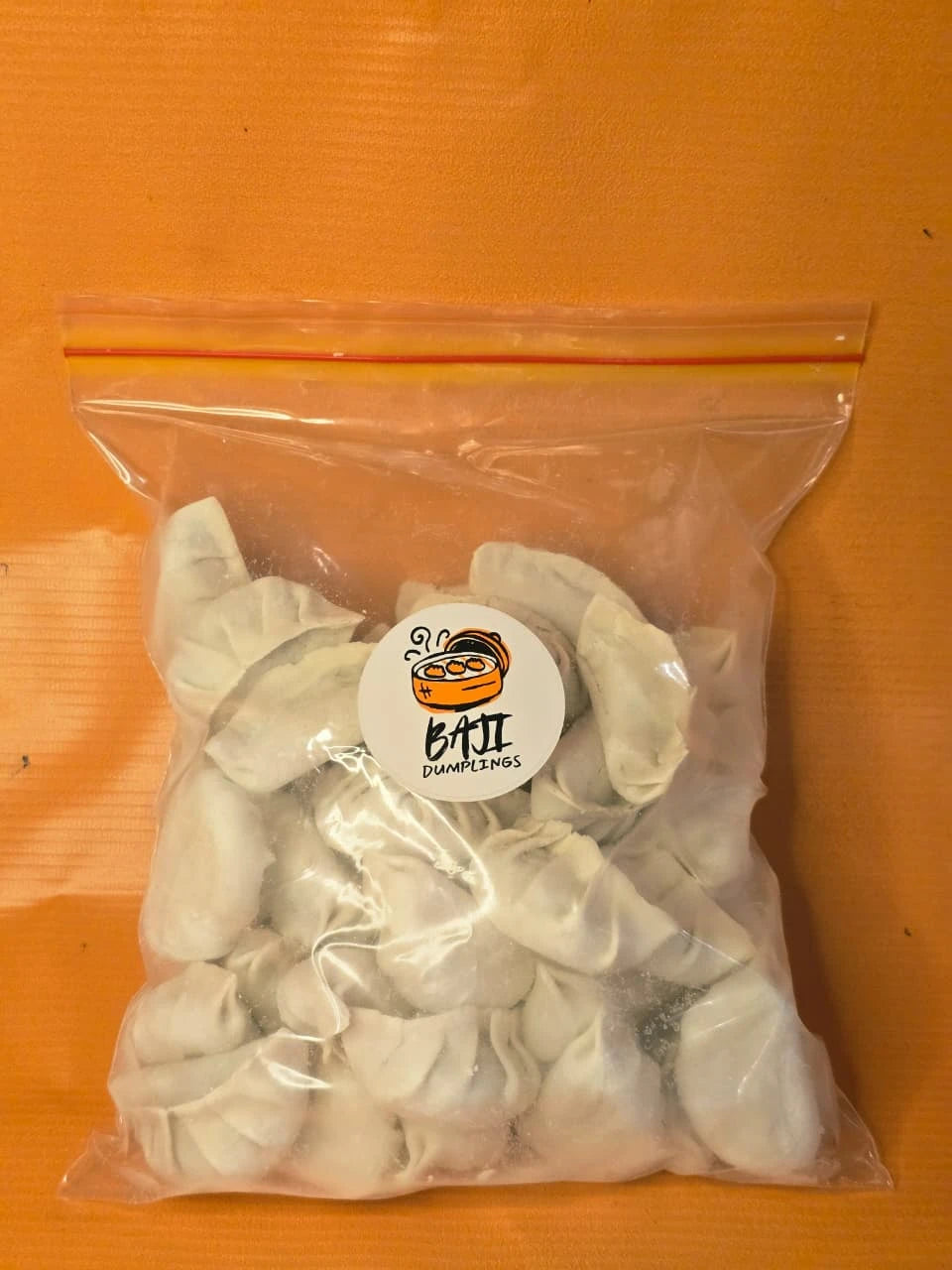 Family pack of frozen Baji Dumplings in a sealed bag