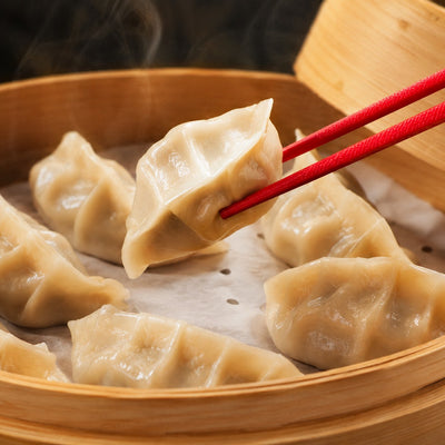 Peppered beef dumplings in a bamboo steamer