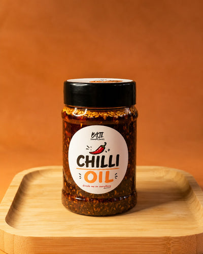 Baji's Chilli Oil, a 200ml jar on a wooden board